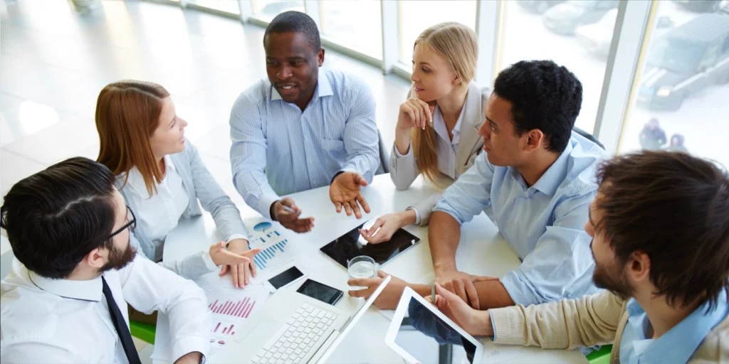 Multiethnic Group of Business People Having a Meeting at the Office and Asking Questions